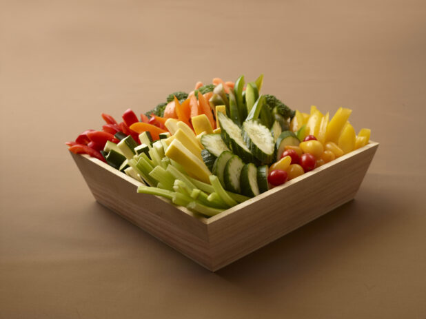 fresh vegetable tray on a brown background