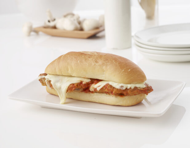 chicken parmesan sandwich on a white roll