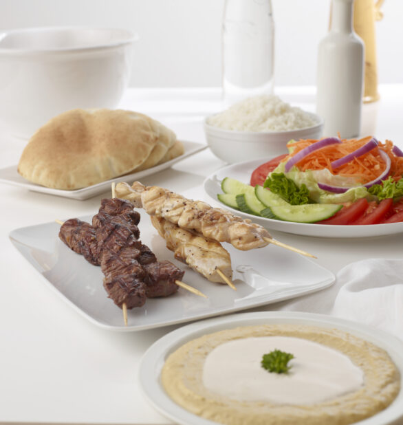 middle eastern grilled beef and chicken skewer plater with humus tahini side sale pita and rice