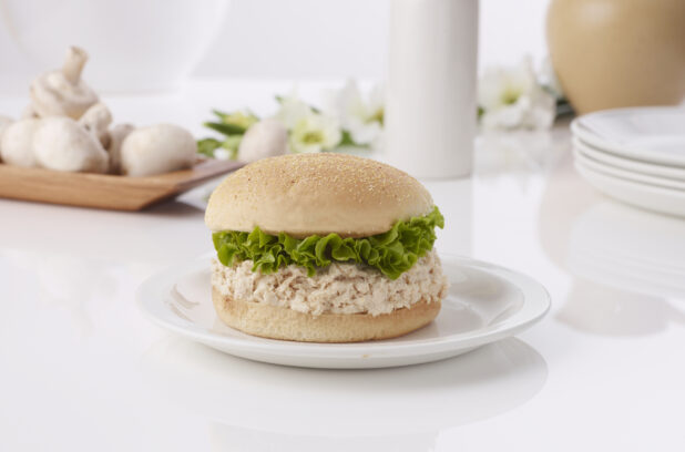 Chicken salad sandwich on a white plate