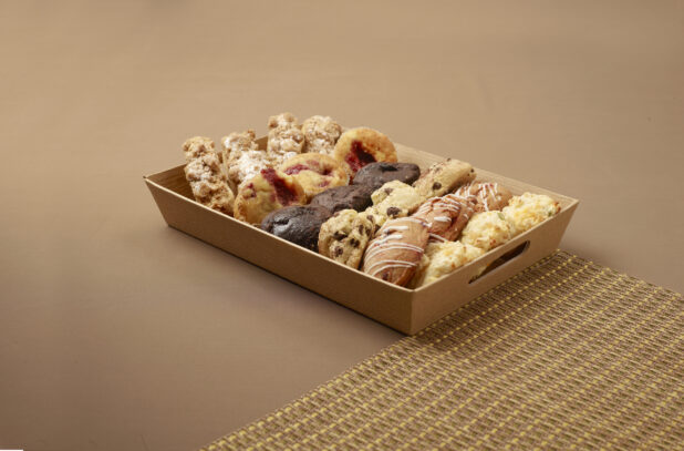 Tray of assorted baked goods for catering - muffins, scones, cookies, biscuits