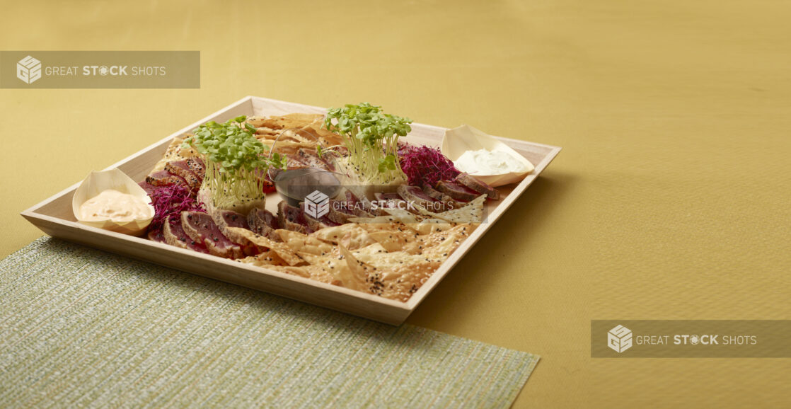 Wood Tray Platter of Seared Sesame-Crusted Tuna Tataki with Sesame Chips and Creamy Dips for Catering