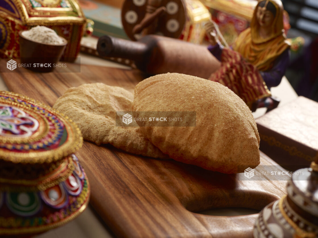 Bhatura - Indian Deep Fried Sourdough Bread - on a Wooden Platter in an Indoor Setting