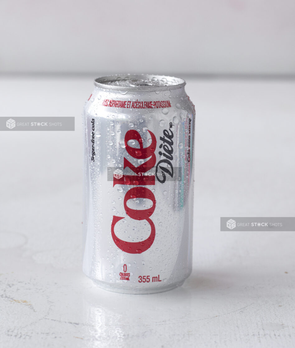 Close Up of a Can of Diet Coke on a White Surface in an Indoor Setting