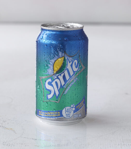 Close Up of a Can of Sprite on a White Surface in an Indoor Setting