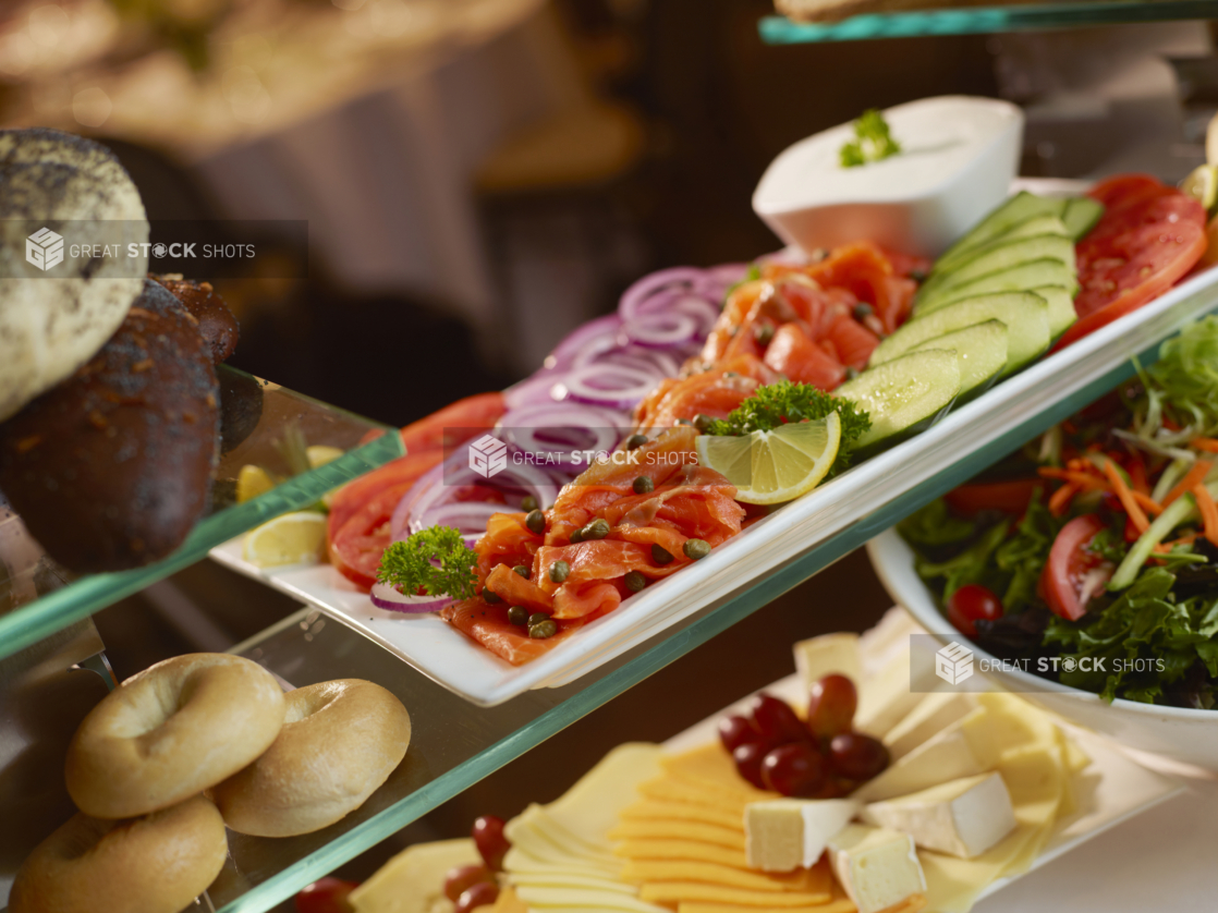 Lox platter on a buffet with cheese tray and bagels