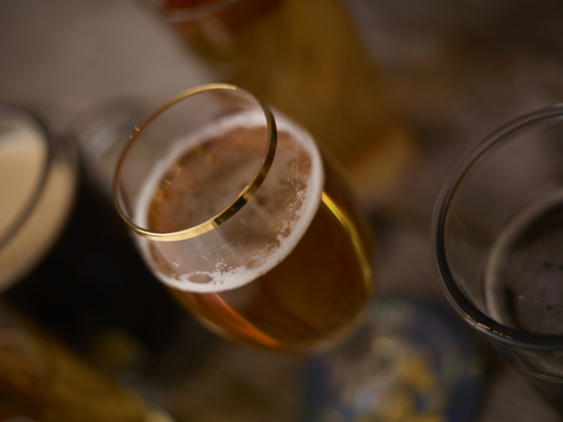 Close Up of a Glass of Beer in an Indoor Restaurant Setting with a Bokeh Effect