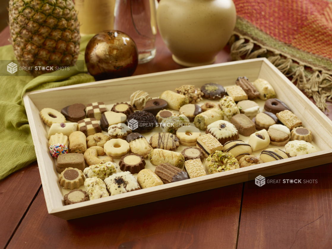 Lebanese Cookie Tray for Catering with Assorted Shortbread, Jam-Filled and Chocolate Covered Cookies on a Wooden Table in an Indoor Setting