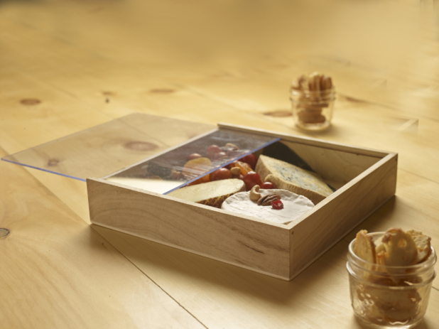 Wooden gift box with cheeses fruit and nuts