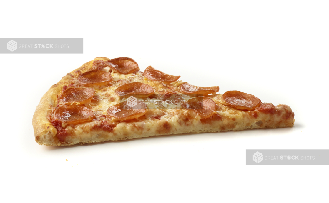 Side View of a Jumbo Pepperoni Pizza Slice Shot on White for Isolation