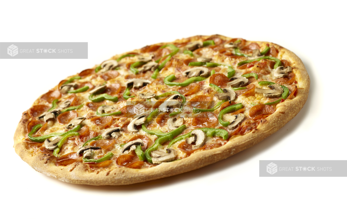 Tilted Angle View of a Whole Jumbo Deluxe Pizza with Pepperoni, Green Peppers and Mushrooms Shot on White for Isolation