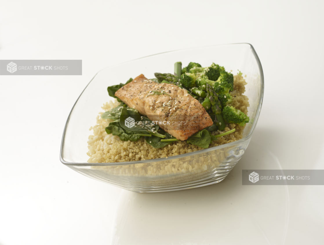 Couscous bowl with poached salmon, brocolli, asparagus and spinach