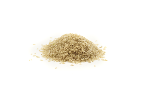 Raw brown rice isolated on white background