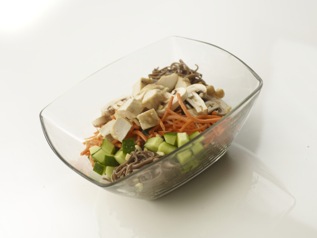 chopped chicken salad with soba noodles in a glass bowl