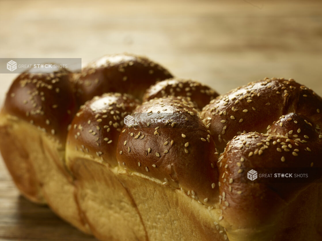 Close up view of a whole uncut challah bread, egg bread