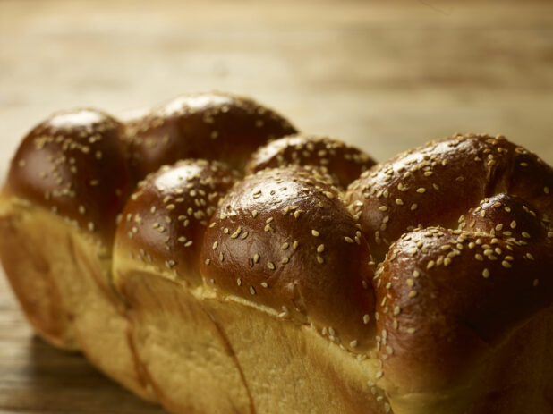 Close up view of a whole uncut challah bread, egg bread