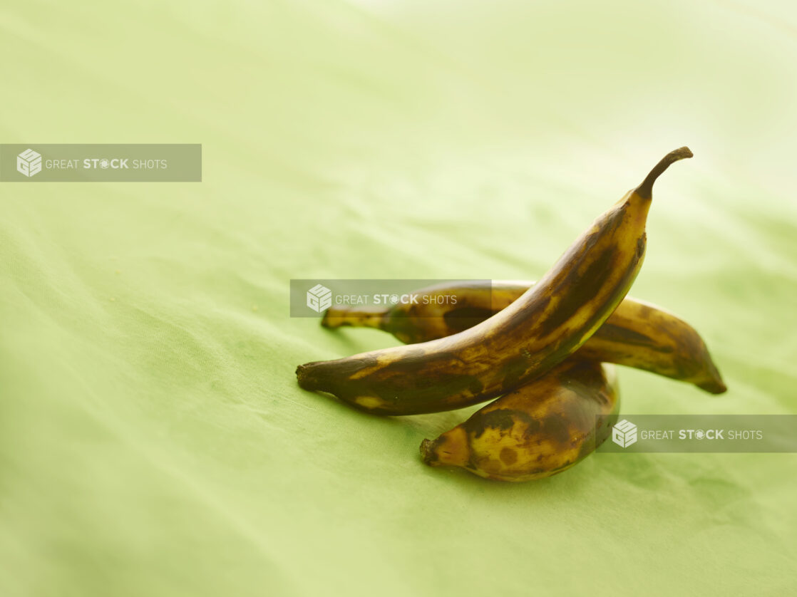 Roasted plantain on a lemon/lime green tablecloth