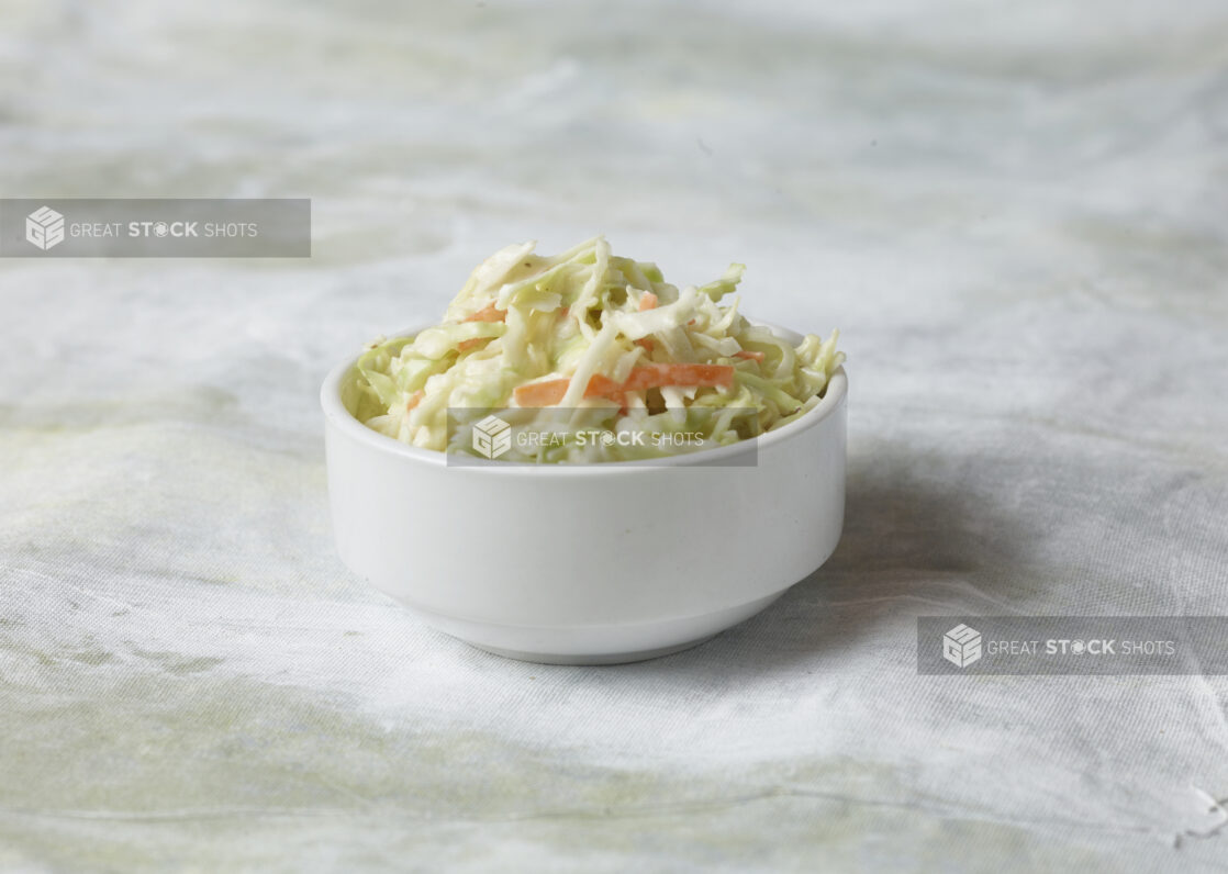 Creamy coleslaw/coleslaw in a white round bowl, side dish