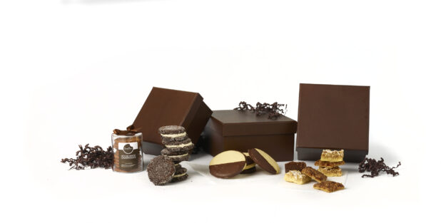 A Gift Box Set of Gourmet Desserts and Baked Goods Shot on White for Isolation