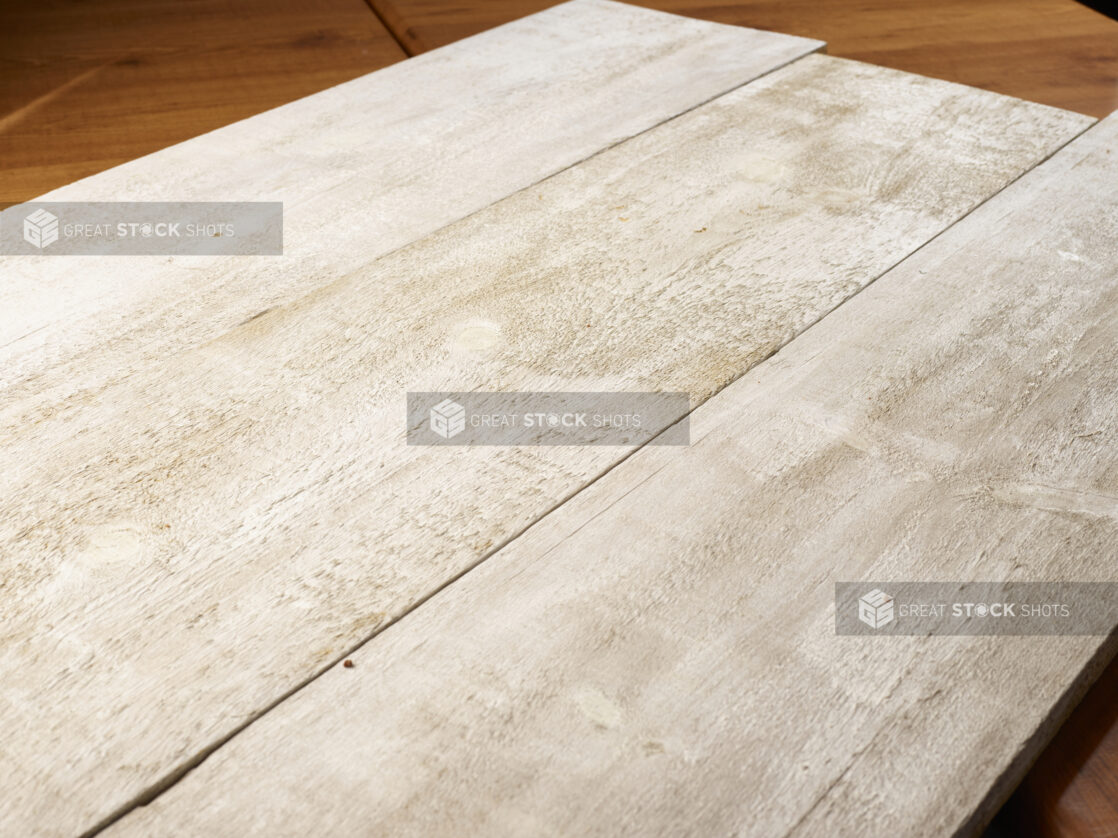 Three whitewashed wooden planks, wood background