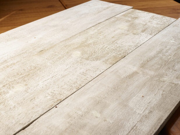 Three whitewashed wooden planks, wood background