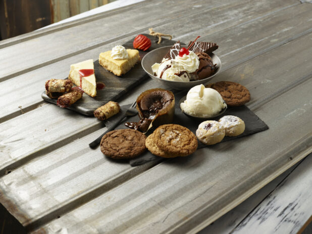 Various desserts on a wooden background