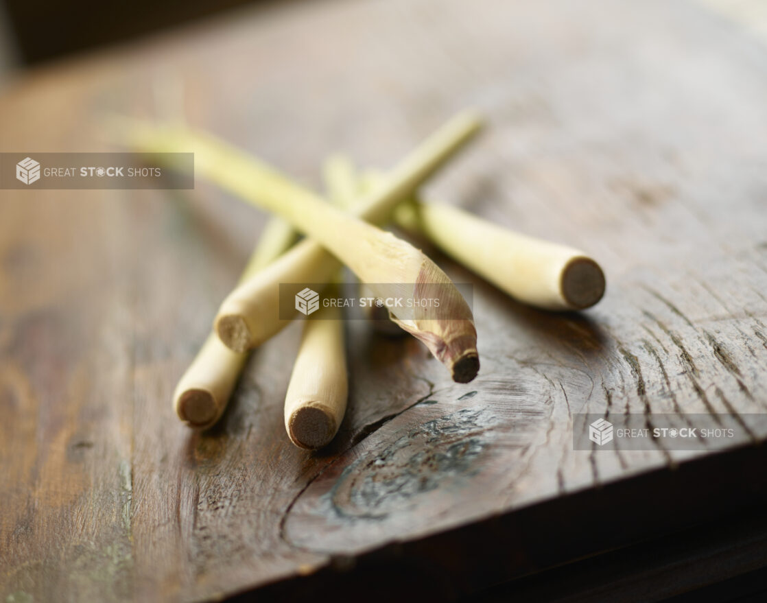 Fresh lemongrass on wooden background with partial focus