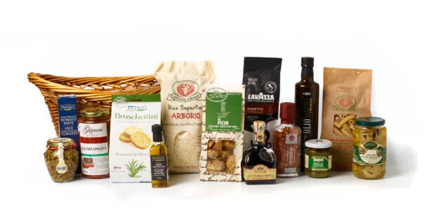 Multiple Italian food products on a white background with a basket