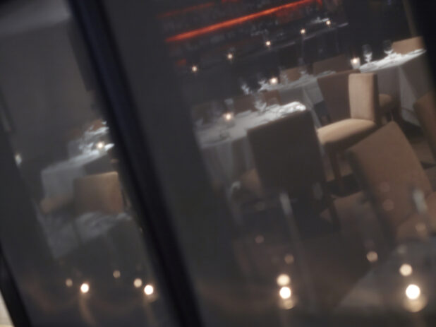 View through a fine dining restaurant window at night