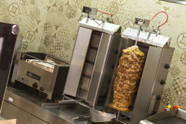 Restaurant equipment, 2 vertical broilers, chicken shawarma, flat top and indoor BBQ on a counter