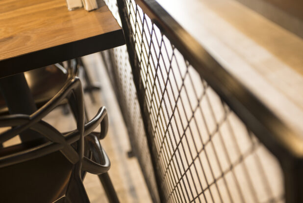 Close up view of seating in restaurant against divider