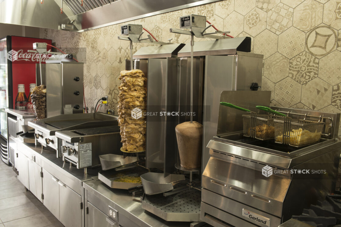 Middle eastern kitchen with vertical broilers, fryer, grill and flat top