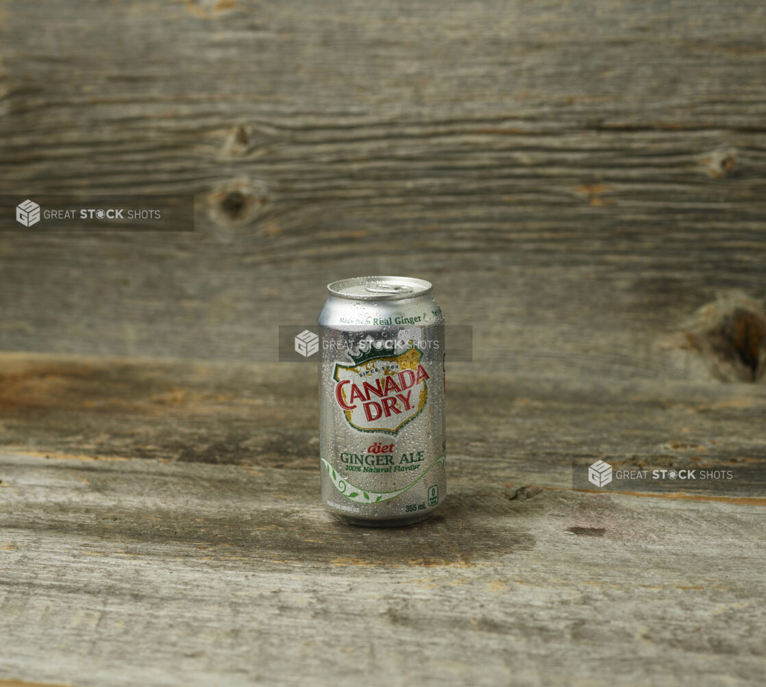 Canada Dry Diet Gingerale in a can on a wooden background and straight on view