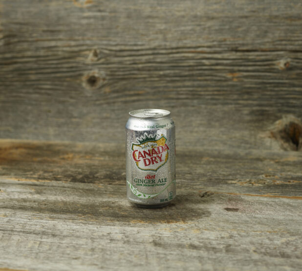 Canada Dry Diet Gingerale in a can on a wooden background and straight on view