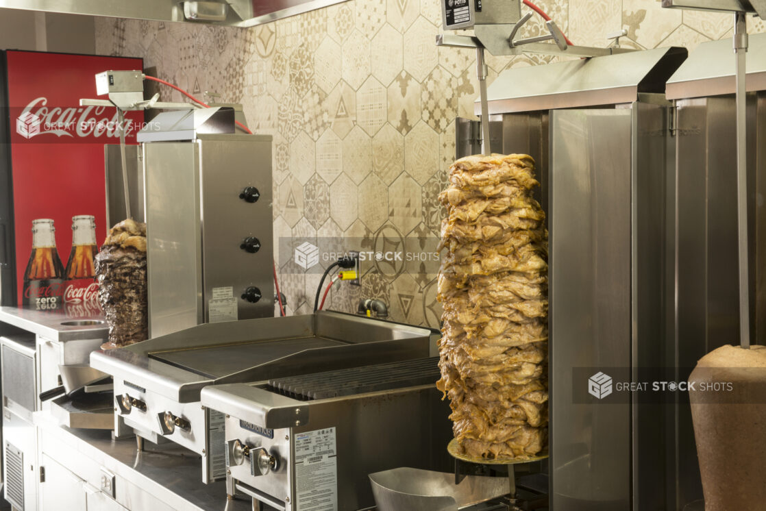 Middle eastern kitchen with vertical shawarma broiler, off centre side view