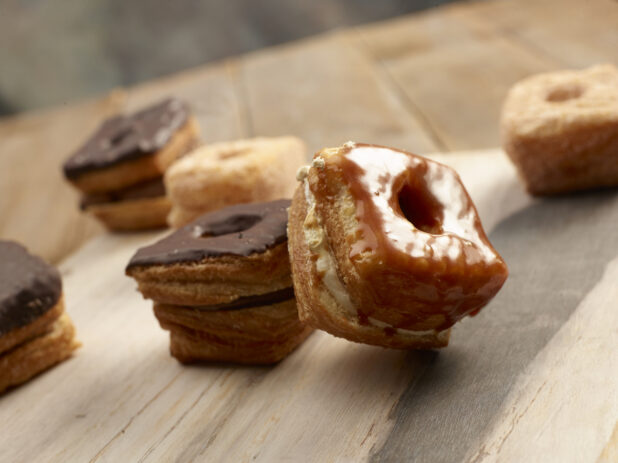 Fancy square donuts on a wooden background