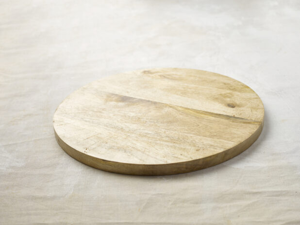 Empty wooden board on a linen background