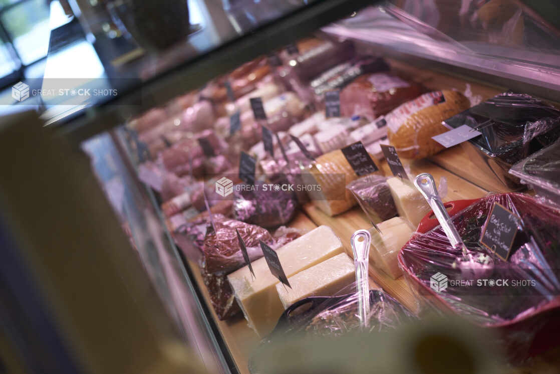 Inside View of a Cheese, Deli Meat and Prepared Salads Counter in a Gourmet Grocery Store