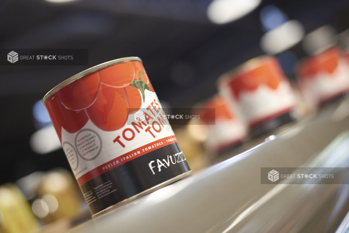 Can of tomatoes on a shelf, close-up