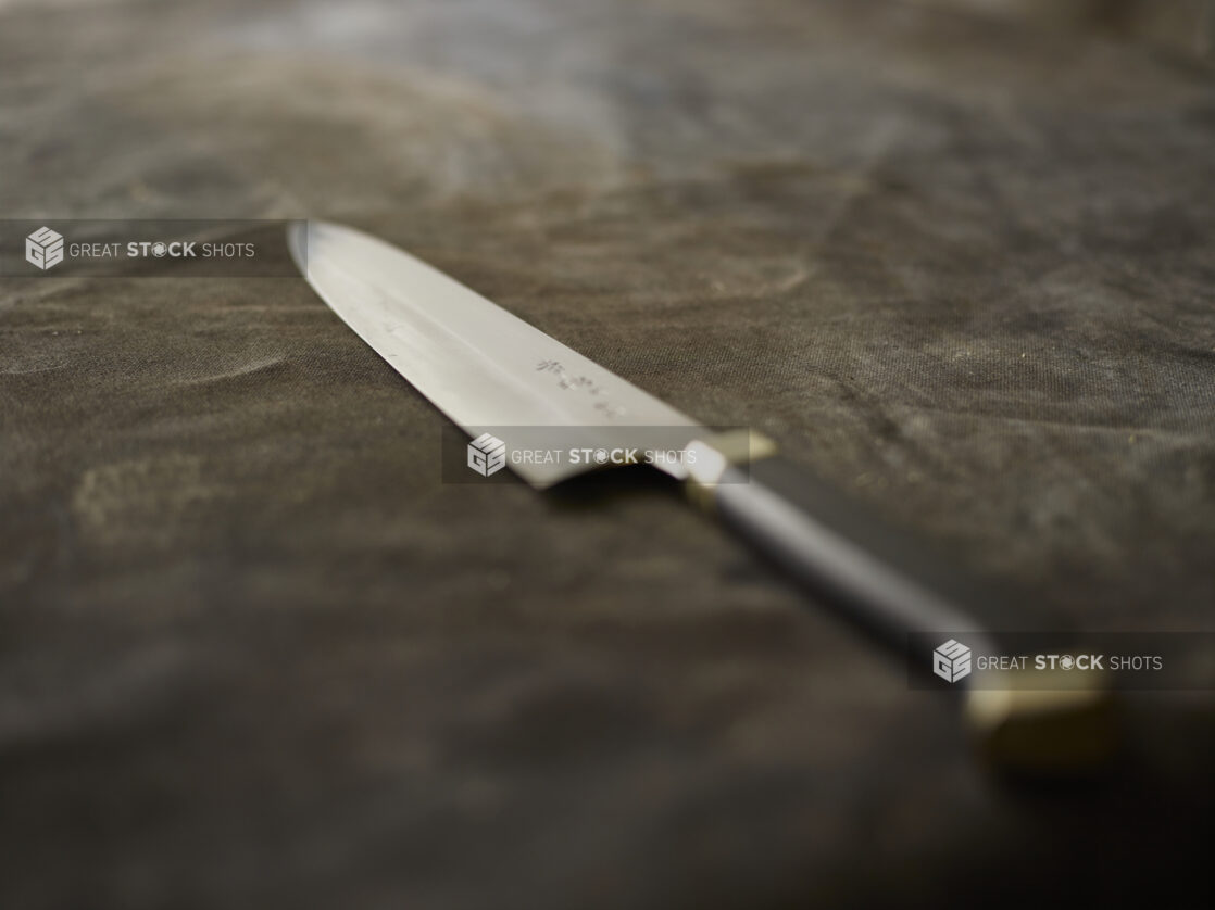 Kitchen knife on a black cloth background