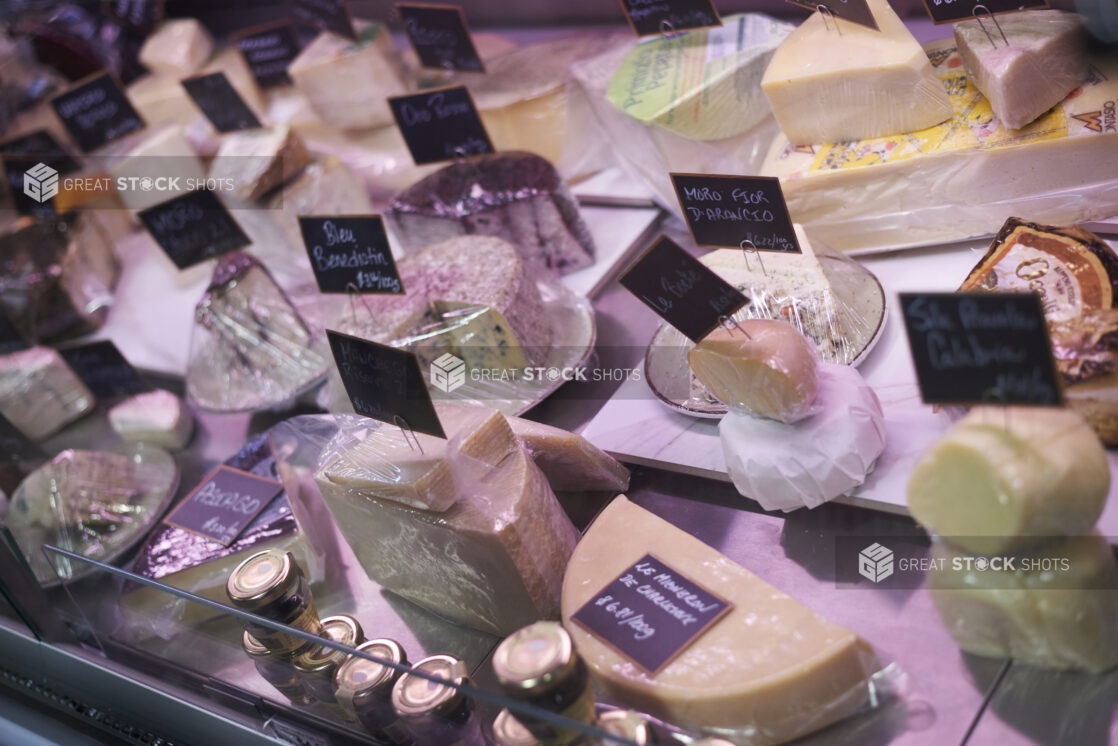 Display case with various artisanal cheeses