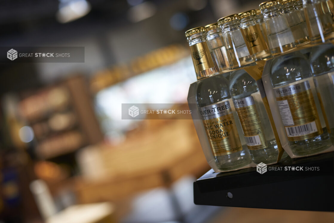 Close Up of Bottles of Fever Tree Tonic Water on a Shelf in a Gourmet Grocery Store Setting