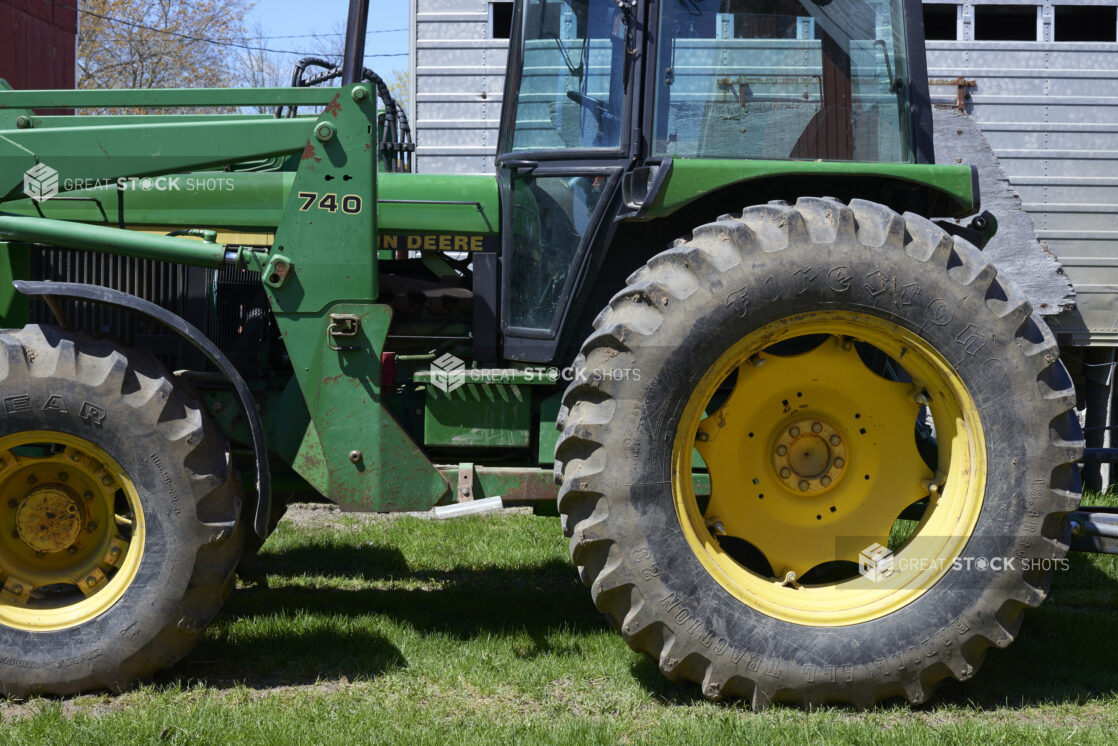 Close Up of a Large Green John Deere Tractor on the Grassy Lawn of a Farm in Ontario, Canada