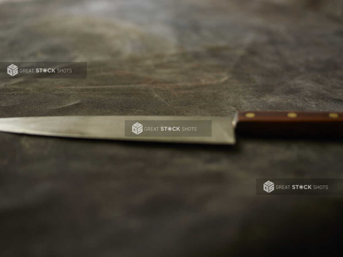 Kitchen knife on a black cloth background