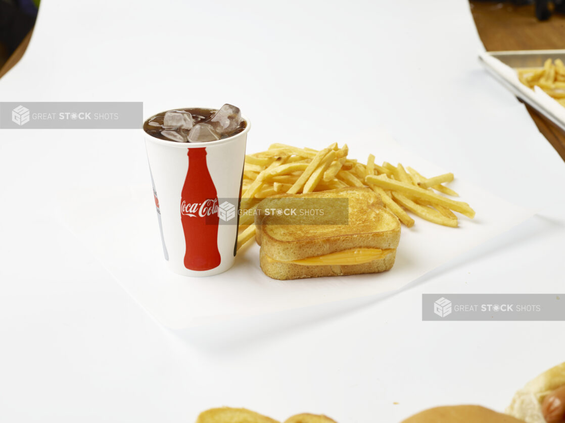 Grilled Cheese Sandwich Combo with French Fries and a Fountain Soda in a Paper Cup with Ice Cubes, on a White Background for Isolation - Variation