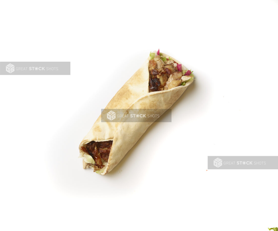 Overhead View of a Chicken Shawarma Pita Wrap with Fresh Vegetable Toppings, Shot on White for Isolation - Variation