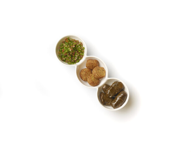 Overhead View of a Trio Plate of Side Dishes: Falafel Balls, Tabbouleh and Stuffed Grape Leaves, on a White Background for Isolation