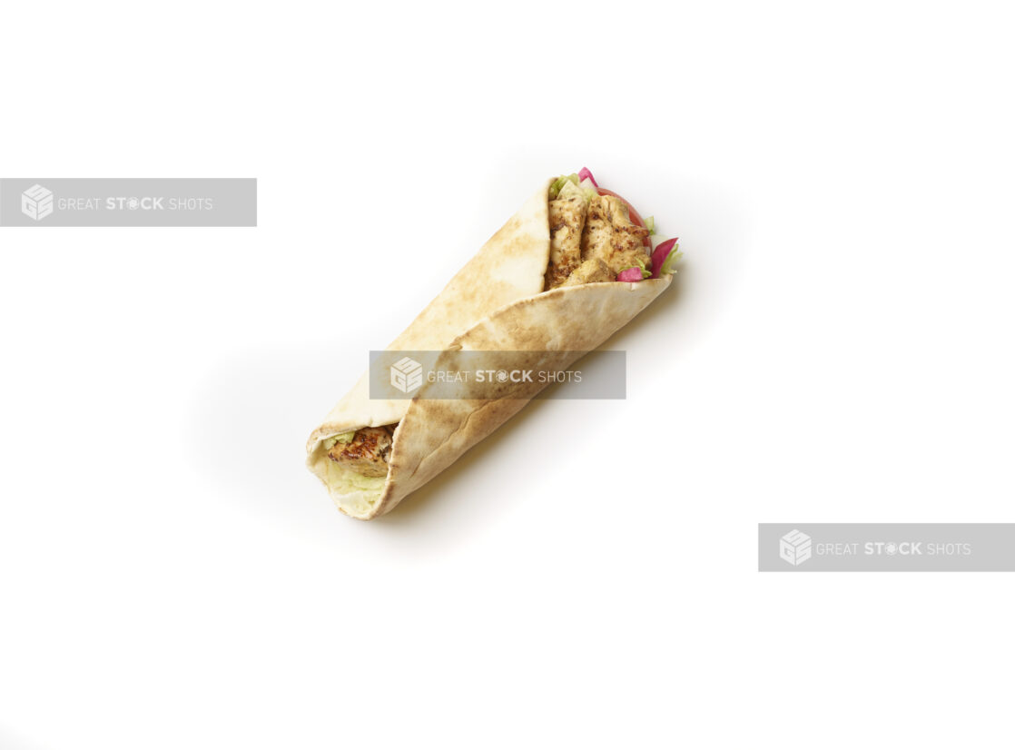 Overhead View of a Chicken Souvlaki Pita Wrap with Fresh Vegetable Toppings, Shot on White for Isolation