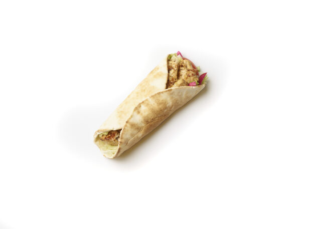 Overhead View of a Chicken Souvlaki Pita Wrap with Fresh Vegetable Toppings, Shot on White for Isolation