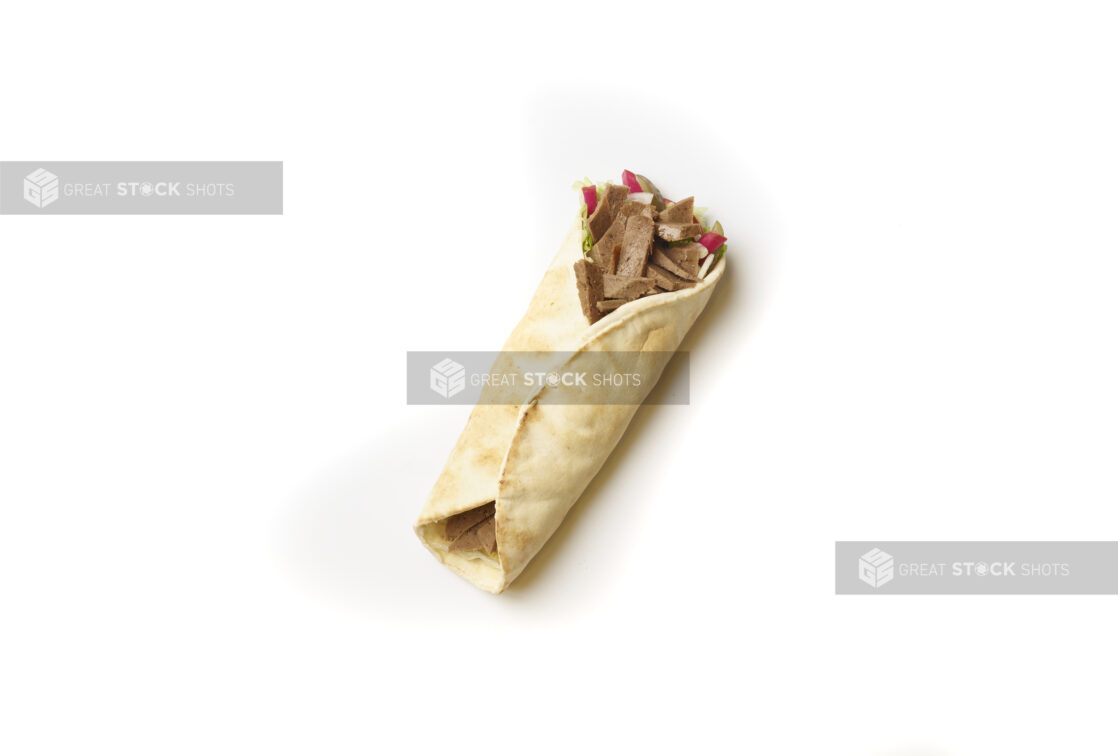 Overhead View of a Gyro Pita Wrap with Fresh Vegetable Toppings, Shot on White for Isolation